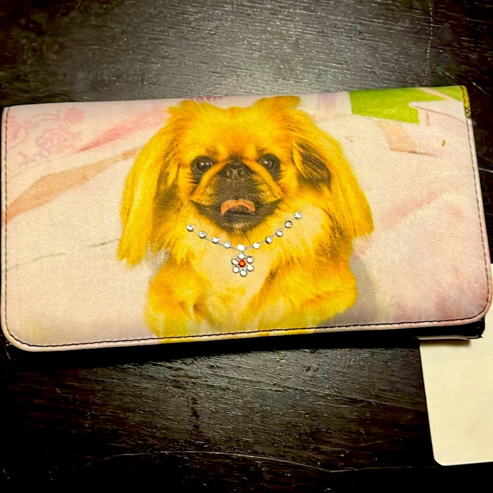 Dog print. Brand new wallet. Some small scuffing on the back. NWT. 7” by 4”